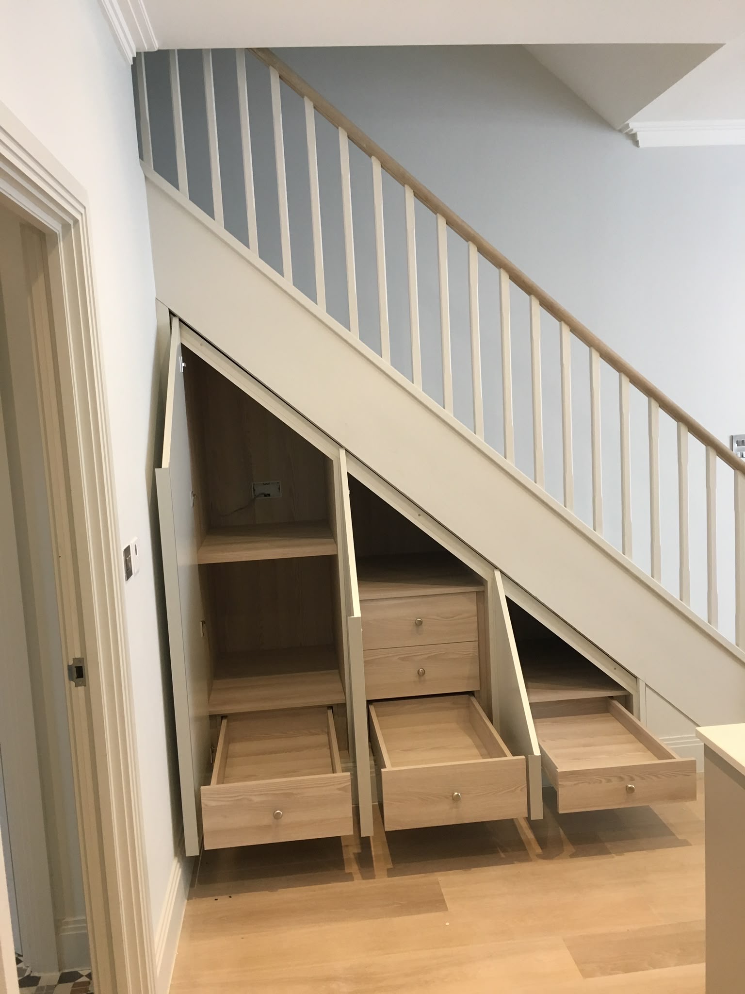 Floor-to-ceiling bespoke library wall with integrated shelving and joinery