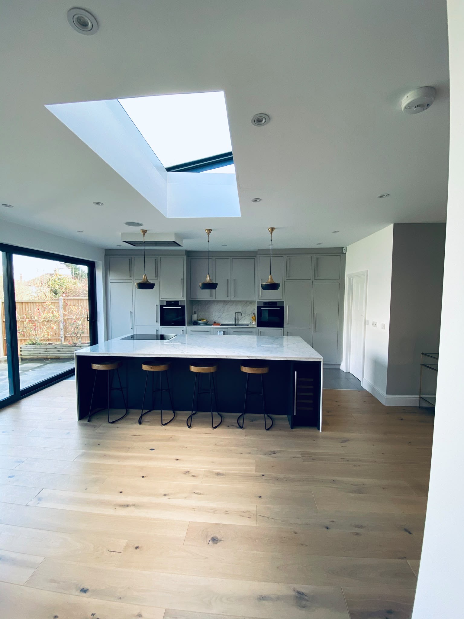 Navy Lacanche kitchen with parquet flooring