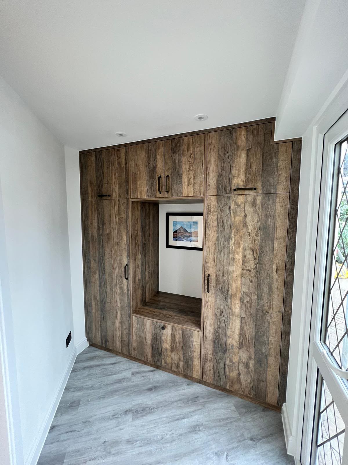 Library wall walnut round table